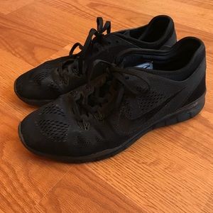 All black Nike sneakers